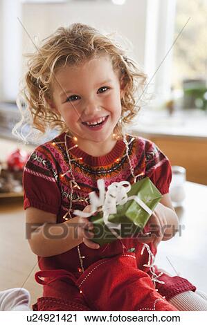 young girl opening present smiling View Large Photo Image Stock Image - young girl opening present smiling. Fotosearch