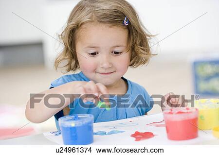 young girl playing with colours View Large Photo Image Picture - young girl playing with colours. Fotosearch
