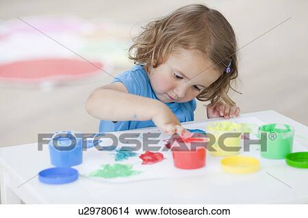 young girl playing with colours View Large Photo Image Picture - young girl playing with colours. Fotosearch