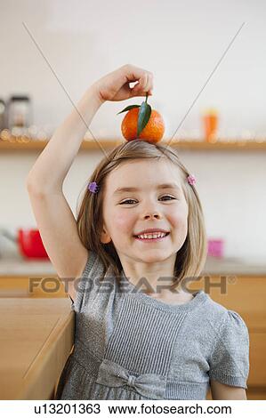 young girl playing with fruit View Large Photo Image Stock Image - young girl playing with fruit. Fotosearch