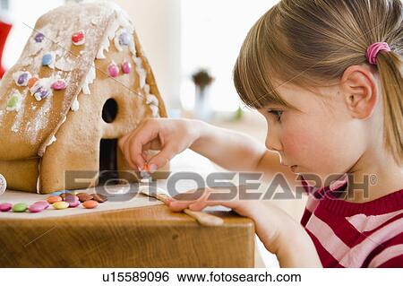 young girl preparing cake house View Large Photo Image Stock Photograph - young girl preparing cake house. Fotosearch