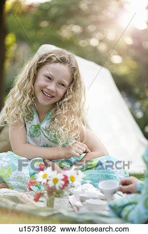 young girl smiling at play picnic View Large Photo Image Stock Image - young girl smiling at play picnic. Fotosearch