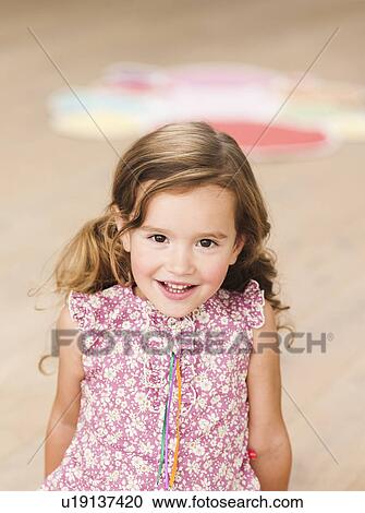 young girl smiling at viewer View Large Photo Image Stock Image - young girl smiling at viewer. Fotosearch