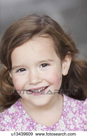 young girl smiling at viewer View Large Photo Image Stock Photo - young girl smiling at viewer. Fotosearch