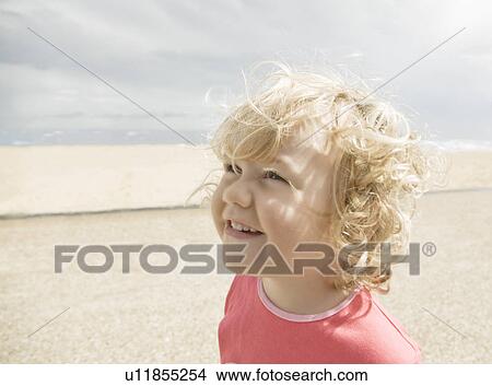 Picture - Young girl smiling promenade. Fotosearch