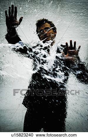 Young man behind glass View Large Photo Image Stock Image - Young man behind glass. Fotosearch