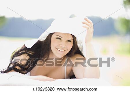 young plump girl lying on a sun lounger View Large Photo Image Stock Image - young plump girl lying on a sun lounger. Fotosearch