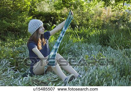 Young woman admiring View Large Photo Image Stock Photo - Young woman admiring. Fotosearch