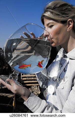 Young woman having fun with her Red Fish View Large Photo Image Stock Image - Young woman having fun with her Red Fish. Fotosearch