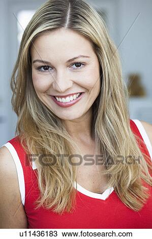 Stock Image - Young woman smiling. Fotosearch