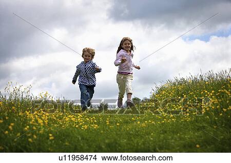 2 young children running. View Large Photo Image Picture - 2 young children running.. Fotosearch