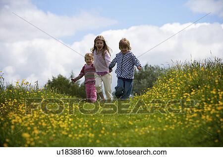 3 young children running. View Large Photo Image Stock Image - 3 young children running.. Fotosearch