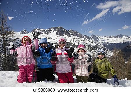 5 kids kneeling throwing snow. View Large Photo Image Stock Image - 5 kids kneeling throwing snow.. Fotosearch