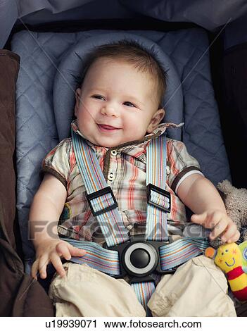 A baby boy in his car seat smiling View Large Photo Image Stock Image - A baby boy in his car seat smiling. Fotosearch