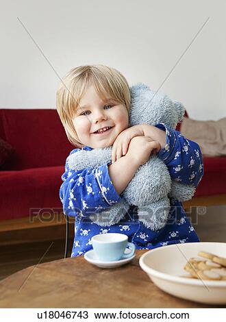 A boy toddler cuddling his teddy bear View Large Photo Image Stock Image - A boy toddler cuddling his teddy bear. Fotosearch