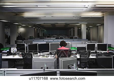 A business woman working late View Large Photo Image Stock Photo - A business woman working late. Fotosearch