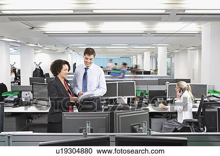 A busy modern office scene View Large Photo Image Stock Image - A busy modern office scene. Fotosearch