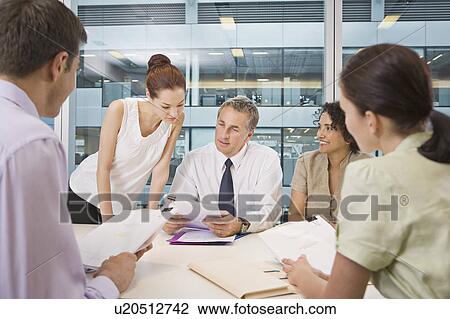 Stock Image - A corporate business meeting. Fotosearch