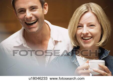 A couple of colleagues smiling View Large Photo Image Stock Image - A couple of colleagues smiling. Fotosearch