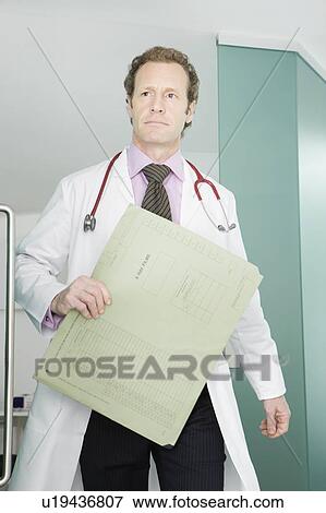 A doctor with some notes View Large Photo Image Stock Photo - A doctor with some notes. Fotosearch