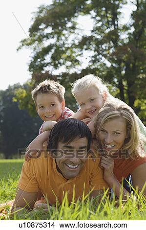 A family portrait in the park View Large Photo Image Picture - A family portrait in the park. Fotosearch