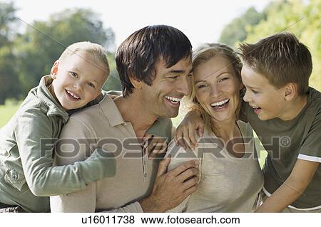 A family portrait in the park View Large Photo Image Stock Photo - A family portrait in the park. Fotosearch