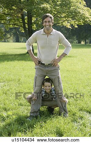 Picture - A father and son in the park.. Fotosearch