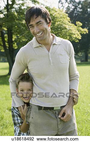 Stock Image - A father and son in the park.. Fotosearch