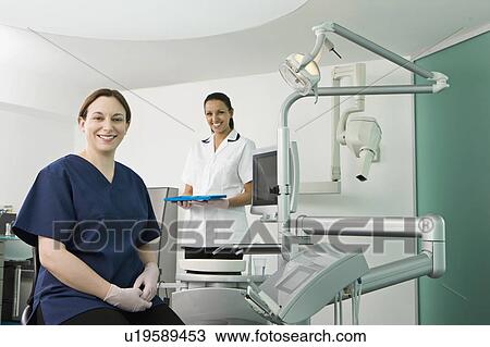 A female dentist and dental nurse View Large Photo Image Stock Image - A female dentist and dental nurse. Fotosearch
