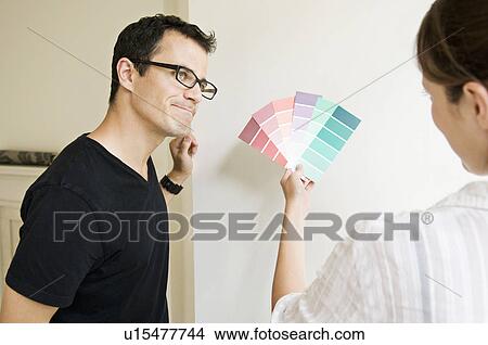 A female showing a male color swabs View Large Photo Image Picture - A female showing a male color swabs. Fotosearch
