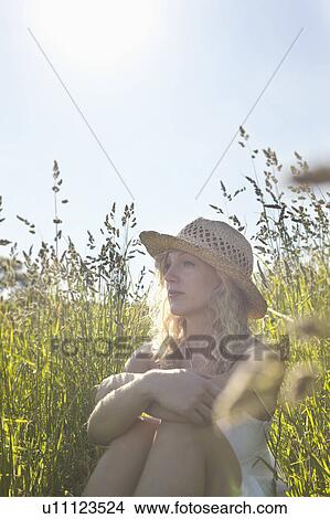A girl in a field View Large Photo Image Picture - A girl in a field. Fotosearch