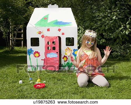 A girl outside her painted wendy house View Large Photo Image Stock Image - A girl outside her painted wendy house. Fotosearch