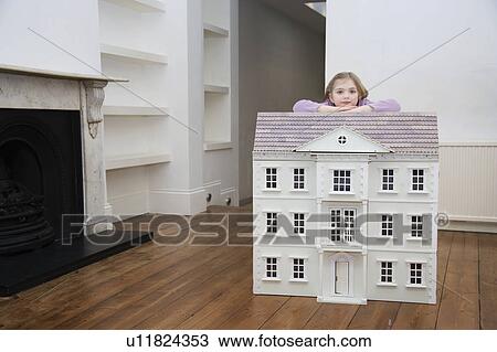 A girl resting on her dollhouse. View Large Photo Image Stock Image - A girl resting on her dollhouse.. Fotosearch