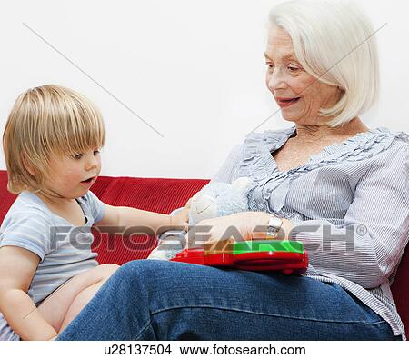 A grandmother playing with her grandson View Large Photo Image Picture - A grandmother playing with her grandson. Fotosearch