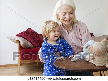A grandmother playing with her grandson View Large Photo Image Stock Image - A grandmother playing with her grandson. Fotosearch