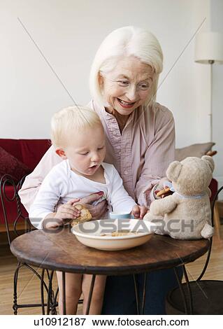Stock Photo - A grandmother playing with her grandson. Fotosearch