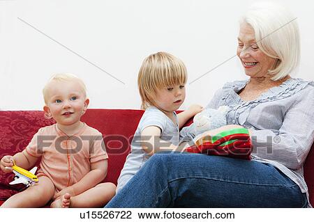 A grandmother playing with two toddlers View Large Photo Image Stock Image - A grandmother playing with two toddlers. Fotosearch