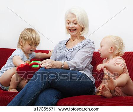 A grandmother playing with two toddlers View Large Photo Image Stock Image - A grandmother playing with two toddlers. Fotosearch