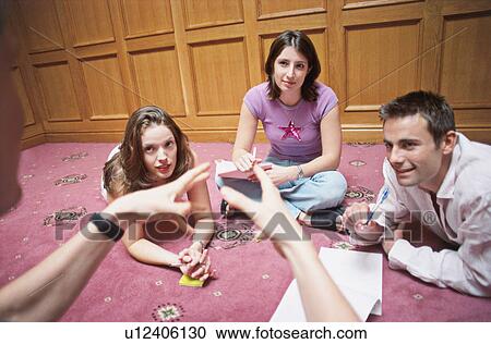 Stock Image - A group listen to a speaker. Fotosearch