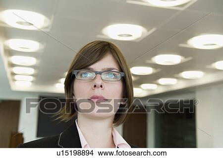 Picture - A head shot of a business woman. Fotosearch