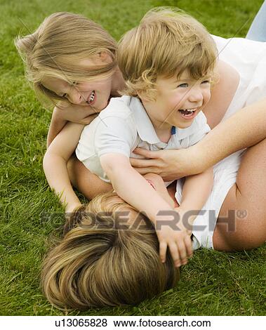 A mother playing with her children View Large Photo Image Stock Photo - A mother playing with her children. Fotosearch