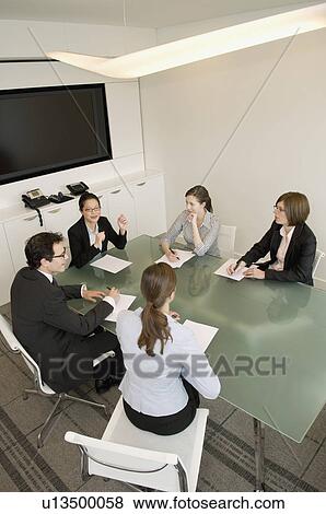 A portrait of a business meeting View Large Photo Image Stock Photo - A portrait of a business meeting. Fotosearch