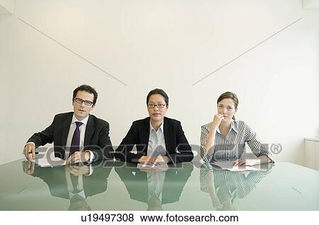 Stock Photo - A portrait of a business trio. Fotosearch