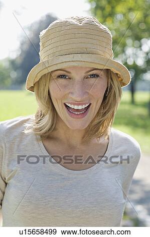 A portrait of a female in a park View Large Photo Image Stock Photo - A portrait of a female in a park. Fotosearch