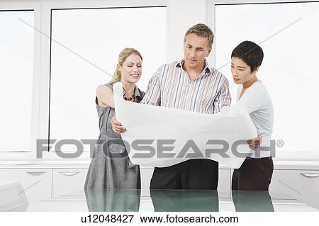 Stock Photo - A portrait of three business people. Fotosearch