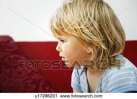 A profile head shot of a young boy View Large Photo Image Stock Image - A profile head shot of a young boy. Fotosearch
