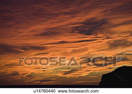 A red sky at sunset View Large Photo Image Stock Image - A red sky at sunset. Fotosearch