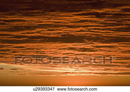 A red sky at sunset View Large Photo Image Stock Photo - A red sky at sunset. Fotosearch