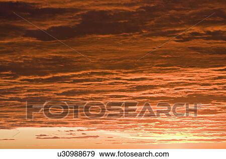 Stock Photo - A red sky at sunset. Fotosearch