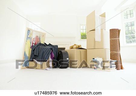 Stock Photograph - A room filled with packed belongings. Fotosearch
